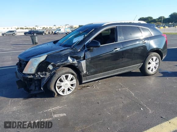 ✅ 2015 Cadillac SRX Luxury Collection • VIN: 3GYFNEE38FS595607 • Lot: 43720579. Listed on IAAI with 103,582 mi. Free auction sales archive from the USA and detailed vehicle history report at DreamBid. Image 2.