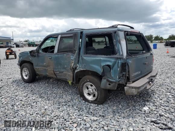 1997 Ford Explorer XL z VIN 1FMDU34E1VZC23403, wystawiony jako Copart lot #80118535 z przebiegiem 148 381 mil mil oraz Nie do naprawy • Non repairable. Historia ofert i sprzedaży dostępna na DreamBid. Obrazek 2.