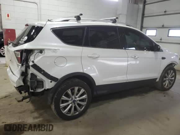 2017 Ford Escape Titanium с VIN 1FMCU9J96HUC05437, выставлен на аукционе Copart как лот 80256605 с пробегом 175 408 миль миль и Списание • Salvage title. История ставок и продаж доступна на DreamBid. Изображение 3.