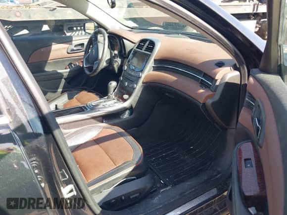 2013 Chevrolet Malibu LTZ with VIN 1G11J5SXXDF304697, listed as a IAAI auction lot 41880763 with 96,220 mi miles and . Bid and sale history available at DreamBid. Image 5.