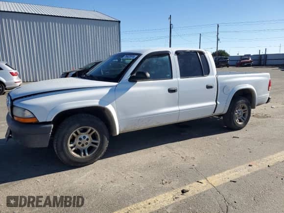2004 Dodge Dakota Sport с VIN 1D7HL38KX4S763919, выставлен на аукционе Copart как лот 76922974 с пробегом 194 178 миль миль и Списание • Salvage title. История ставок и продаж доступна на DreamBid. Изображение 1.