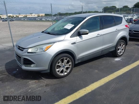 ✅ 2013 Ford Escape SEL • VIN: 1FMCU0H98DUD10959 • Lot: 43637339. Listed on IAAI with 152,762 mi. Free auction sales archive from the USA and detailed vehicle history report at DreamBid. Image 2.
