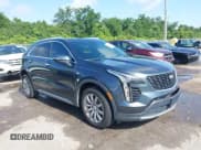 ✅ 2021 Cadillac XT4 FWD Premium Luxury • VIN: 1GYFZCR42MF007617 • Лот: 42437974. Опубликован ранее на IAAI с пробегом 126 071 миль. Бесплатный доступ к архиву аукционных продаж из США и подробный отчёт об истории автомобиля на DreamBid. Изображение 1.