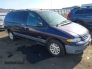 ✅ 1997 Plymouth Voyager SE • VIN: 1P4GP44R0VB307945 • Lot: 42121657. Listed on IAAI with 128,357 mi. Free auction sales archive from the USA and detailed vehicle history report at DreamBid. Image 1.