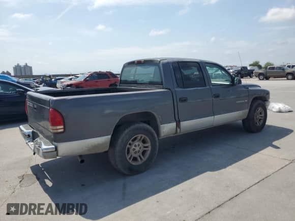 2002 Dodge Dakota SLT z VIN 1B7HL48X52S688636, wystawiony jako Copart lot #53062325 z przebiegiem 224 011 mil mil oraz Szkoda całkowita • Salvage title. Historia ofert i sprzedaży dostępna na DreamBid. Obrazek 3.