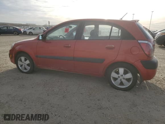 ✅ 2007 Kia Rio SX • VIN: KNADE163276293916 • Лот: 81728705. Опубликован ранее на Copart с пробегом Не указан. Бесплатный доступ к архиву аукционных продаж из США и подробный отчёт об истории автомобиля на DreamBid. Изображение 2.