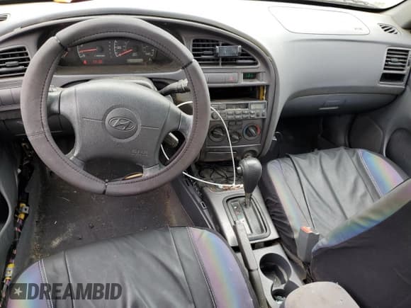 ✅ 2003 Hyundai Elantra GLS • VIN: KMHDN45DX3U593994 • Lot: 57074365. Wystawiony na Copart z przebiegiem 261 040 mil. Bezpłatny archiwum sprzedaży aukcyjnych z USA i szczegółowy raport historii pojazdu na DreamBid. Zdjęcie 8.