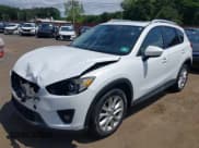 ✅ 2014 Mazda CX-5 Grand Touring • VIN: JM3KE4DY3E0351047 • Lot: 42802433. Wystawiony na IAAI z przebiegiem 61 544 mil. Bezpłatny archiwum sprzedaży aukcyjnych z USA i szczegółowy raport historii pojazdu na DreamBid. Zdjęcie 6.