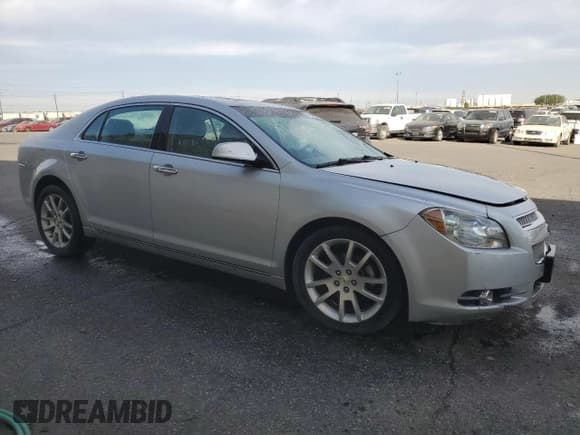 ✅ 2012 Chevrolet Malibu LTZ • VIN: 1G1ZG5E7XCF128343 • Lot: 74536074. Listed on Copart with 132,162 mi. Free auction sales archive from the USA and detailed vehicle history report at DreamBid. Image 4.