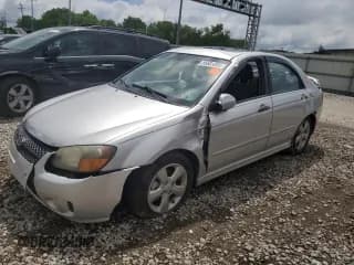 ✅ 2009 Kia Spectra EX • VIN: KNAFE221795027173 • Lot: 56683355. Listed on Copart with Not provided. Free auction sales archive from the USA and detailed vehicle history report at DreamBid. Image 1.