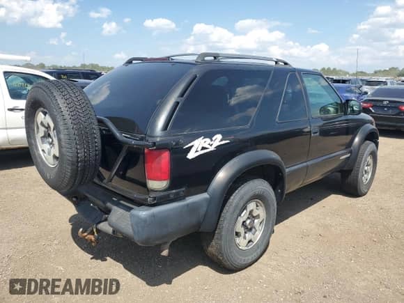 2005 Chevrolet Blazer LS with VIN 1GNCT18X45K101945, listed as a Copart auction lot 62762255 with 160,212 mi miles and Salvage title. Bid and sale history available at DreamBid. Image 3.