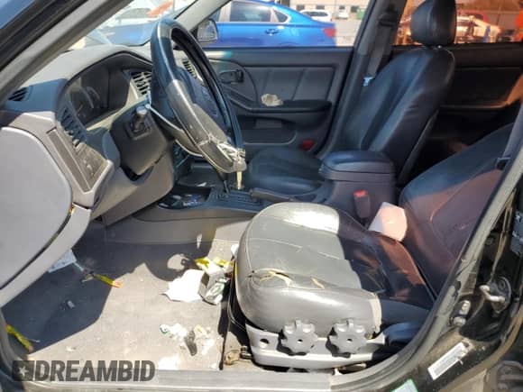 2003 Hyundai Elantra GLS z VIN KMHDN45D43U509474, wystawiony jako Copart lot #71657564 z przebiegiem 346 936 mil mil oraz Szkoda całkowita • Salvage title. Historia ofert i sprzedaży dostępna na DreamBid. Obrazek 7.