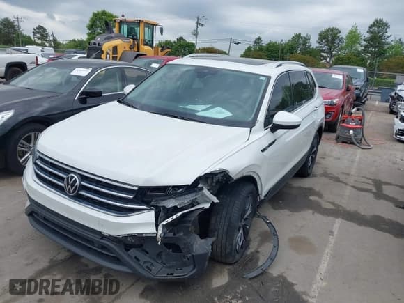 ✅ 2023 Volkswagen Tiguan SE • VIN: 3VVMB7AX0PM036876 • Lot: 42023415. Listed on IAAI with 42,003 mi. Free auction sales archive from the USA and detailed vehicle history report at DreamBid. Image 2.