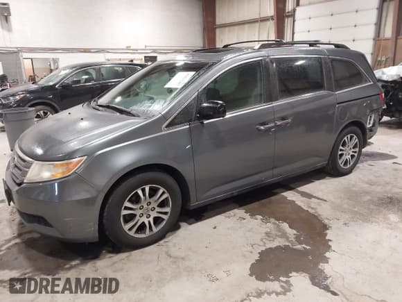 ✅ 2012 Honda Odyssey EX-L • VIN: 5FNRL5H67CB100705 • Lot: 43821207. Listed on IAAI with 105,432 mi. Free auction sales archive from the USA and detailed vehicle history report at DreamBid. Image 2.