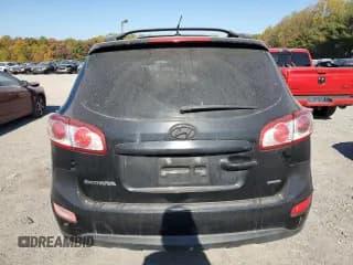 ✅ 2012 Hyundai Santa Fe SE • VIN: 5XYZHDAG2CG127768 • Lot: 77075924. Listed on Copart with 149,980 mi. Free auction sales archive from the USA and detailed vehicle history report at DreamBid. Image 6.