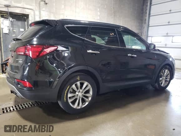 2017 Hyundai Santa Fe 2.0T z VIN 5XYZUDLA2HG435261, wystawiony jako Copart lot #68190485 z przebiegiem 125 513 mil mil oraz Szkoda całkowita • Salvage title. Historia ofert i sprzedaży dostępna na DreamBid. Obrazek 3.