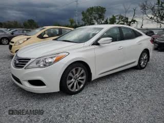 ✅ 2014 Hyundai Azera • VIN: KMHFG4JG9EA419079 • Lot: 61906195. Listed on Copart with 159,334 mi. Free auction sales archive from the USA and detailed vehicle history report at DreamBid. Image 1.