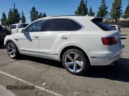 ✅ 2019 Bentley Bentayga V8 • VIN: SJAAM2ZV7KC027119 • Lot: 84956865. Wystawiony na Copart z przebiegiem 52 297 mil. Bezpłatny archiwum sprzedaży aukcyjnych z USA i szczegółowy raport historii pojazdu na DreamBid. Zdjęcie 2.