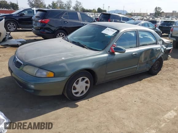 ✅ 1998 Mazda 626 DX • VIN: 1YVGF22C2W5691764 • Lot: 43677590. Wystawiony na IAAI z przebiegiem 142 191 mil. Bezpłatny archiwum sprzedaży aukcyjnych z USA i szczegółowy raport historii pojazdu na DreamBid. Zdjęcie 2.