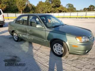 2005 Hyundai Accent GLS with VIN KMHCG45C35U595666, listed as a Copart auction lot 88294365 with 70,497 mi miles and Salvage title. Bid and sale history available at DreamBid. Image 4.
