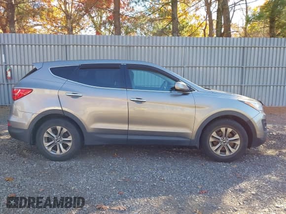 ✅ 2015 Hyundai Santa Fe • VIN: 5XYZTDLB4FG282648 • Лот: 43621938. Опубликован ранее на IAAI с пробегом 162 620 миль. Бесплатный доступ к архиву аукционных продаж из США и подробный отчёт об истории автомобиля на DreamBid. Изображение 13.