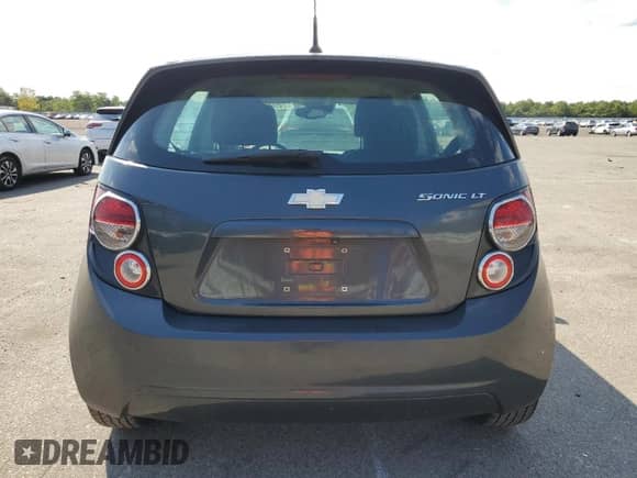 2014 Chevrolet Sonic LT with VIN 1G1JC6SHXE4115537, listed as a Copart auction lot 70566134 with 140,983 mi miles and Salvage title. Bid and sale history available at DreamBid. Image 6.