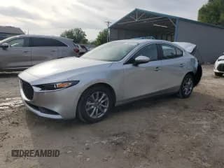 ✅ 2021 Mazda 3 2.0 • VIN: 3MZBPAA74MM203513 • Lot: 53690645. Listed on Copart with 40,986 mi. Free auction sales archive from the USA and detailed vehicle history report at DreamBid. Image 1.