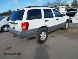 ✅ 2004 Jeep Grand Cherokee Laredo • VIN: 1J4GW48NX4C407942 • Лот: 43629318. Опубликован ранее на IAAI с пробегом 164 889 миль. Бесплатный доступ к архиву аукционных продаж из США и подробный отчёт об истории автомобиля на DreamBid. Изображение 4.