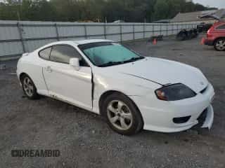 ✅ 2005 Hyundai Tiburon GS • VIN: KMHHM65D35U184724 • Лот: 84444495. Опубликован ранее на Copart с пробегом 203 238 миль. Бесплатный доступ к архиву аукционных продаж из США и подробный отчёт об истории автомобиля на DreamBid. Изображение 4.