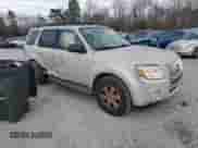 2009 Mercury Mariner with VIN 4M2CU81759KJ04555, listed as a Copart auction lot 85778504 with 130,514 mi miles and Salvage title. Bid and sale history available at DreamBid. Image 4.