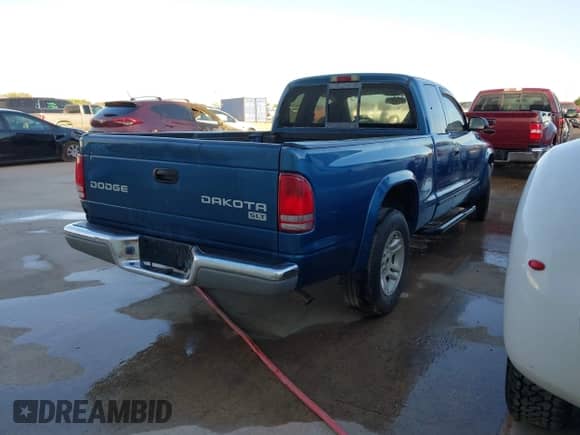 2003 Dodge Dakota SLT with VIN 1D7HL42N93S196397, listed as a IAAI auction lot 42105857 with 159,690 mi miles and . Bid and sale history available at DreamBid. Image 4.