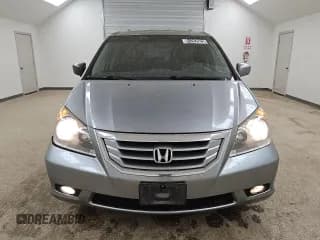 ✅ 2009 Honda Odyssey Touring • VIN: 5FNRL38959B020293 • Lot: 91262625. Wystawiony na Copart z przebiegiem 218 525 mil. Bezpłatny archiwum sprzedaży aukcyjnych z USA i szczegółowy raport historii pojazdu na DreamBid. Zdjęcie 5.
