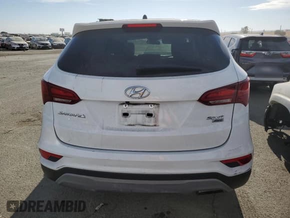 ✅ 2018 Hyundai Santa Fe 2.4L • VIN: 5NMZTDLB4JH083792 • Лот: 62271733. Опубликован ранее на Copart с пробегом Не указан. Бесплатный доступ к архиву аукционных продаж из США и подробный отчёт об истории автомобиля на DreamBid. Изображение 6.