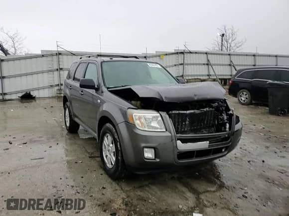 2009 Mercury Mariner z VIN 4M2CU81G39KJ17532, wystawiony jako Copart lot #43907455 z przebiegiem 214 212 mil mil oraz Szkoda całkowita • Salvage title. Historia ofert i sprzedaży dostępna na DreamBid. Obrazek 11.
