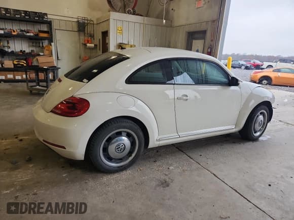 ✅ 2013 Volkswagen Beetle 2.5L • VIN: 3VWJX7AT1DM632703 • Lot: 92857275. Listed on Copart with 144,477 mi. Free auction sales archive from the USA and detailed vehicle history report at DreamBid. Image 3.