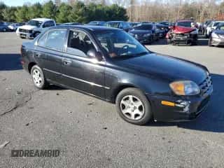 2005 Hyundai Accent GLS with VIN KMHCG45C15U662362, listed as a Copart auction lot 80574774 with 122,898 mi miles and Salvage title. Bid and sale history available at DreamBid. Image 4.