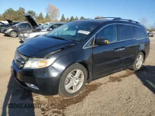 ✅ 2012 Honda Odyssey Touring • VIN: 5FNRL5H94CB079872 • Lot: 91557415. Listed on Copart with 91,466 mi. Free auction sales archive from the USA and detailed vehicle history report at DreamBid. Image 1.