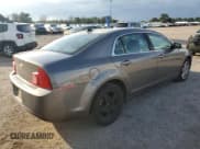 ✅ 2012 Chevrolet Malibu 1LS • VIN: 1G1ZB5E03CF340048 • Lot: 85201505. Listed on Copart with 143,836 mi. Free auction sales archive from the USA and detailed vehicle history report at DreamBid. Image 3.