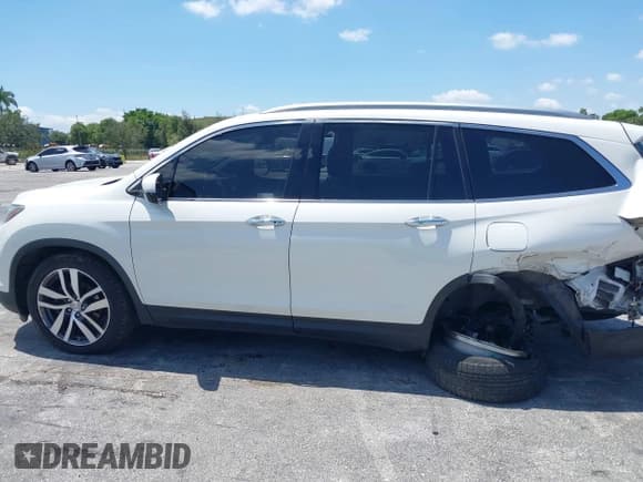✅ 2018 Honda Pilot Elite • VIN: 5FNYF6H00JB058623 • Lot: 42323415. Listed on IAAI with 102,015 mi. Free auction sales archive from the USA and detailed vehicle history report at DreamBid. Image 15.