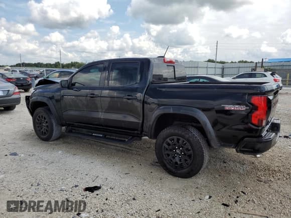 ✅ 2023 Chevrolet Colorado 4WD Trail Boss • VIN: 1GCPTEEK0P1252834 • Лот: 71637444. Опубликован ранее на Copart с пробегом 8 096 миль. Бесплатный доступ к архиву аукционных продаж из США и подробный отчёт об истории автомобиля на DreamBid. Изображение 2.