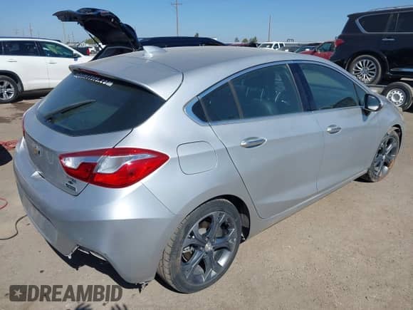 2017 Chevrolet Cruze Premier z VIN 3G1BF6SM0HS589882, wystawiony jako IAAI lot #43099837 z przebiegiem 97 850 mil mil oraz . Historia ofert i sprzedaży dostępna na DreamBid. Obrazek 4.