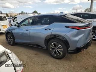 ✅ 2023 Lexus RZ 450e Premium • VIN: JTJAAAAB1PA005958 • Lot: 80736244. Wystawiony na Copart z przebiegiem 21 413 mil. Bezpłatny archiwum sprzedaży aukcyjnych z USA i szczegółowy raport historii pojazdu na DreamBid. Zdjęcie 2.