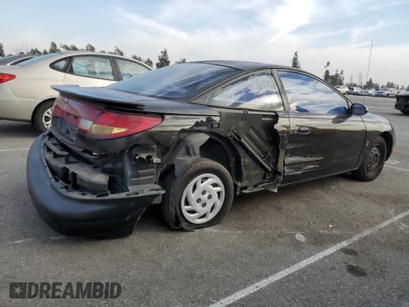 ✅ 1997 Saturn SC • VIN: 1G8ZF1286VZ350275 • Лот: 83010514. Опубликован ранее на Copart с пробегом 143 241 миль. Бесплатный доступ к архиву аукционных продаж из США и подробный отчёт об истории автомобиля на DreamBid. Изображение 3.