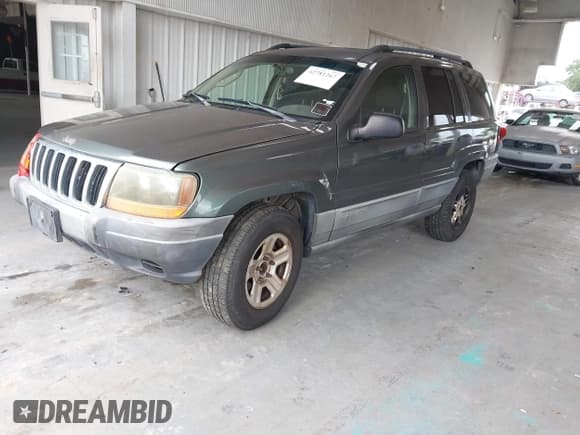 ✅ 2002 Jeep Grand Cherokee Laredo • VIN: 1J4GW48NX2C196495 • Lot: 42781267. Listed on IAAI with 209,655 mi. Free auction sales archive from the USA and detailed vehicle history report at DreamBid. Image 17.