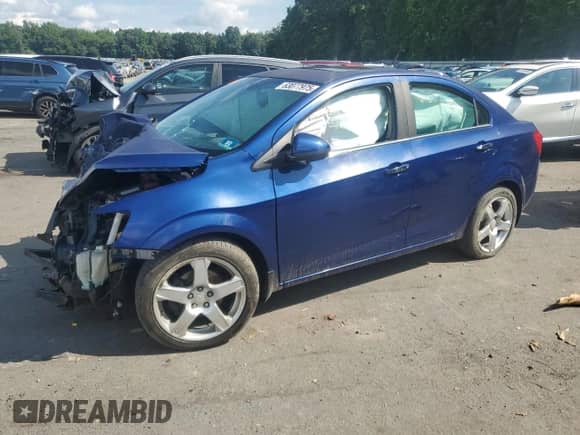 2012 Chevrolet Sonic LTZ z VIN 1G1JE5SB4C4213587, wystawiony jako Copart lot #63077975 z przebiegiem Nie podano mil oraz Szkoda całkowita • Salvage title. Historia ofert i sprzedaży dostępna na DreamBid. Obrazek 1.