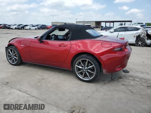 ✅ 2021 Mazda MX-5 Miata Grand Touring • VIN: JM1NDAD7XM0458609 • Лот: 55657955. Опубликован ранее на Copart с пробегом 26 780 миль. Бесплатный доступ к архиву аукционных продаж из США и подробный отчёт об истории автомобиля на DreamBid. Изображение 2.