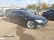 ✅ 2014 Tesla Model S P85D • VIN: 5YJSA1H26EFP64042 • Lot: 43591926. Listed on IAAI with 122,087 mi. Free auction sales archive from the USA and detailed vehicle history report at DreamBid. Image 1.