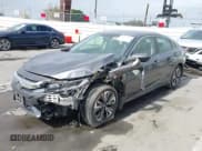 ✅ 2018 Honda Civic EX-T • VIN: JHMFC1F38JX020125 • Lot: 42342438. Listed on IAAI with 115,037 mi. Free auction sales archive from the USA and detailed vehicle history report at DreamBid. Image 6.