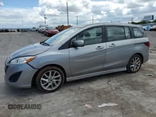 ✅ 2014 Mazda 5 Grand Touring • VIN: JM1CW2DL1E0165803 • Lot: 56289435. Listed on Copart with 79,876 mi. Free auction sales archive from the USA and detailed vehicle history report at DreamBid. Image 1.