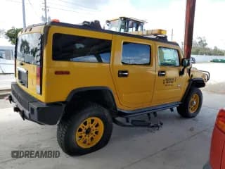 ✅ 2003 Hummer H2 • VIN: 5GRGN23U63H106323 • Лот: 76447054. Опубликован ранее на Copart с пробегом Не указан. Бесплатный доступ к архиву аукционных продаж из США и подробный отчёт об истории автомобиля на DreamBid. Изображение 3.